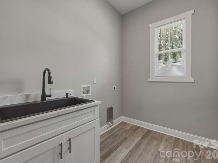 5330 Tuckaseegee Road, Charlotte, NC 28208.  MLS# CAR4372285, YatesRealty ID 26761. Laundry room