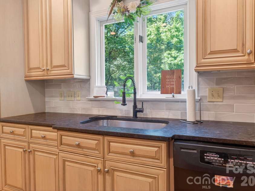 1819 Kilmonack Lane, Charlotte, NC 28270.  MLS# CAR4376693, YatesRealty ID 26765. Kitchen over looking back deck