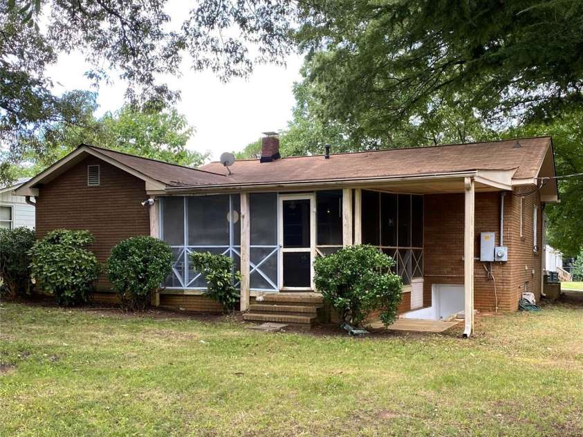 3702 Crawford Street, Gastonia, NC 28052.  MLS# CAR4275636, YatesRealty ID 26767. Back view of home sits on .26 acres.