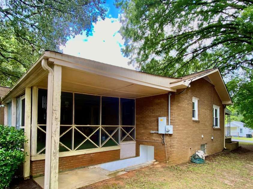 3702 Crawford Street, Gastonia, NC 28052.  MLS# CAR4275636, YatesRealty ID 26767. Left side of home with steps to the Basement