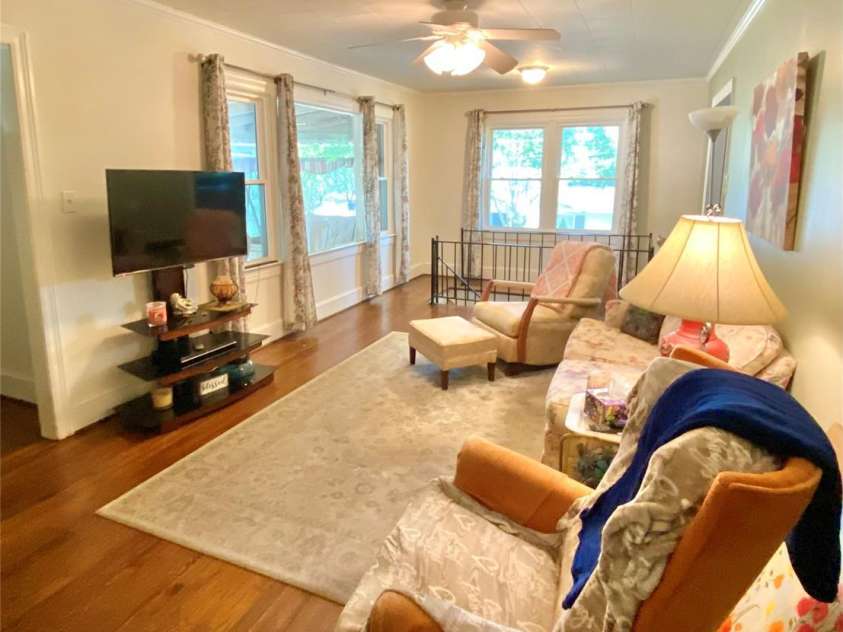 3702 Crawford Street, Gastonia, NC 28052.  MLS# CAR4275636, YatesRealty ID 26767. Living room with ceiling light/fan and beautiful hardwoods.