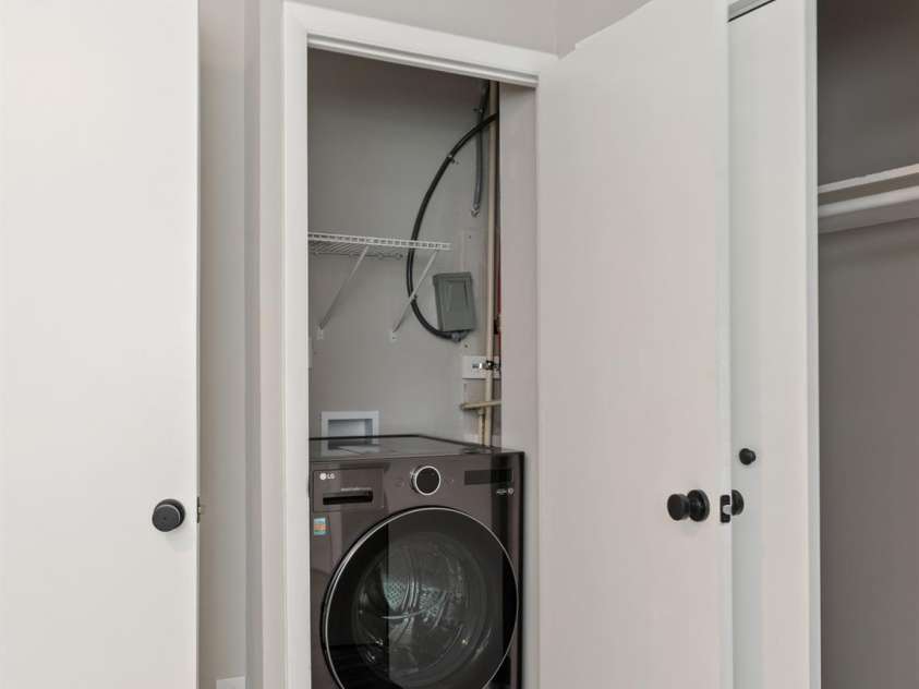 2000 Patio Court, Charlotte, NC 28205.  MLS# CAR4270954, YatesRealty ID 2677. New LG washer/dryer all in one combo unit conveys. Storage shelf above for laundry supplies.