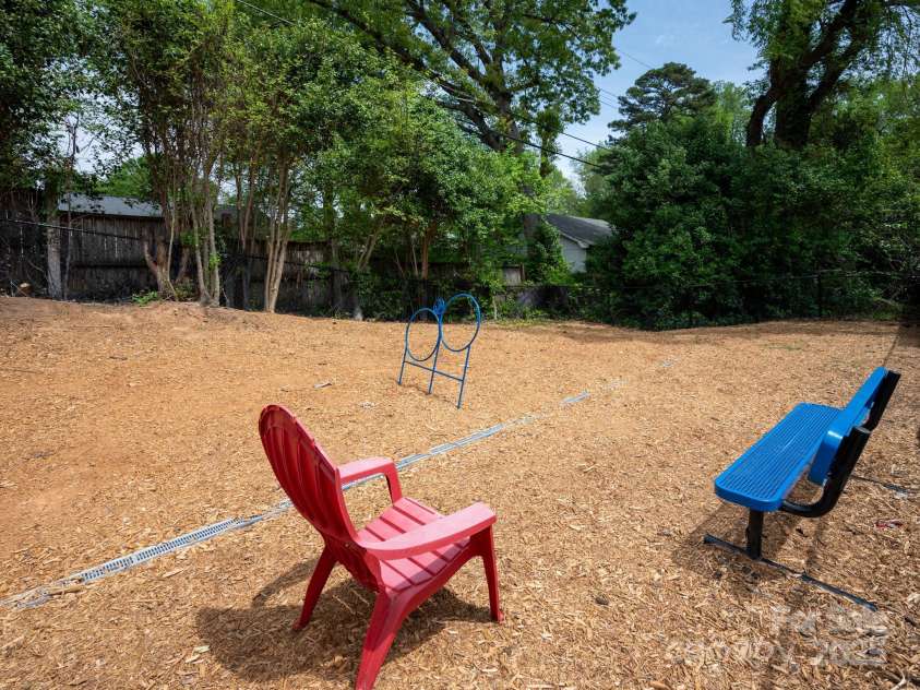 2000 Patio Court, Charlotte, NC 28205.  MLS# CAR4270954, YatesRealty ID 2677. Seating for dog park