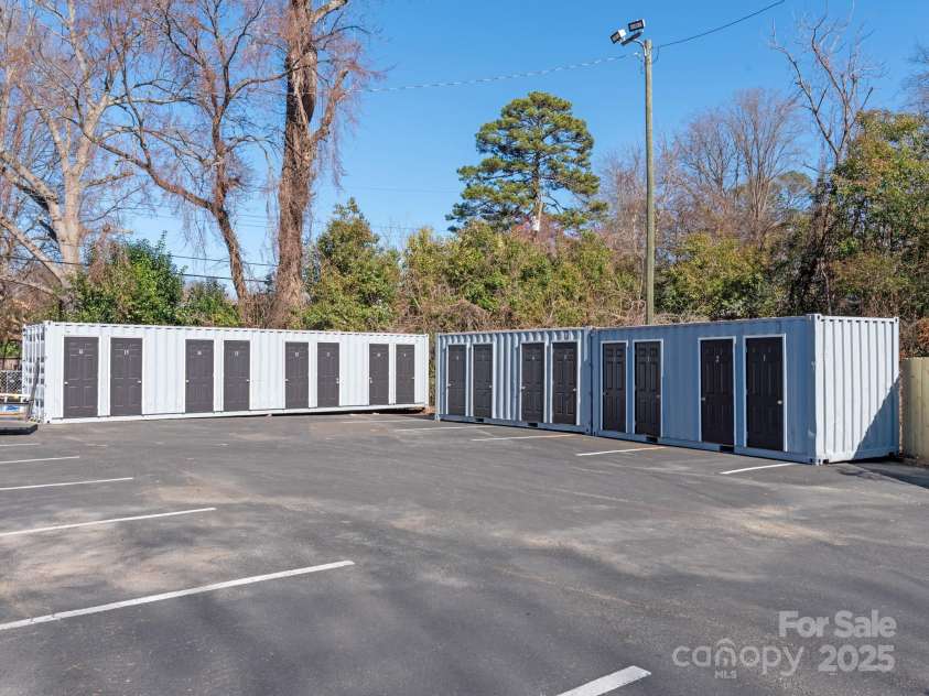 2000 Patio Court, Charlotte, NC 28205.  MLS# CAR4270954, YatesRealty ID 2677. Storage units in back available to purchase and have deeded to unit. Perfect area to store a bike.