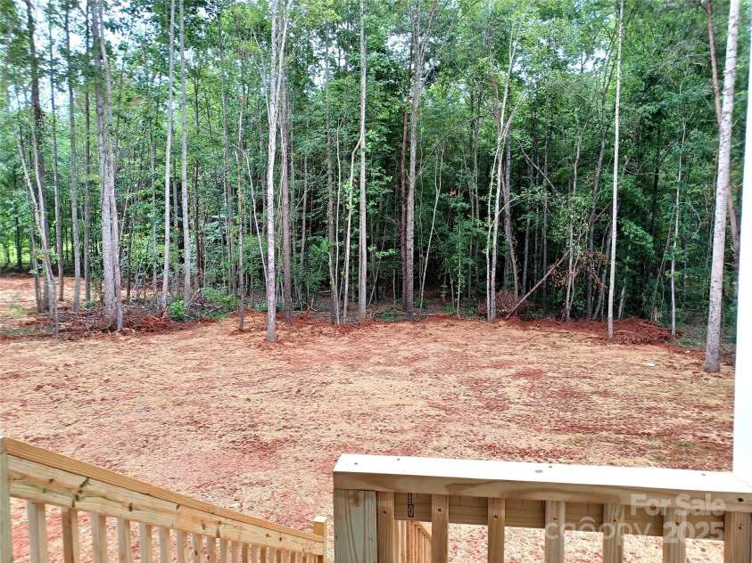 368 Lippard Farm Road, Statesville, NC 28625.  MLS# CAR4277518, YatesRealty ID 26788. Rear yard is partially cleared for entertaining but surrounded by peaceful shady woods...