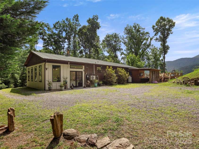 44 Sutton Knob Road, Candler, NC 28715.  MLS# CAR4252708, YatesRealty ID 26806. Back of house & Driveway