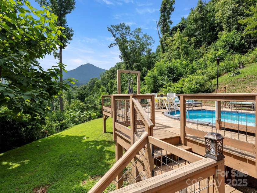 44 Sutton Knob Road, Candler, NC 28715.  MLS# CAR4252708, YatesRealty ID 26806. Beautiful deck