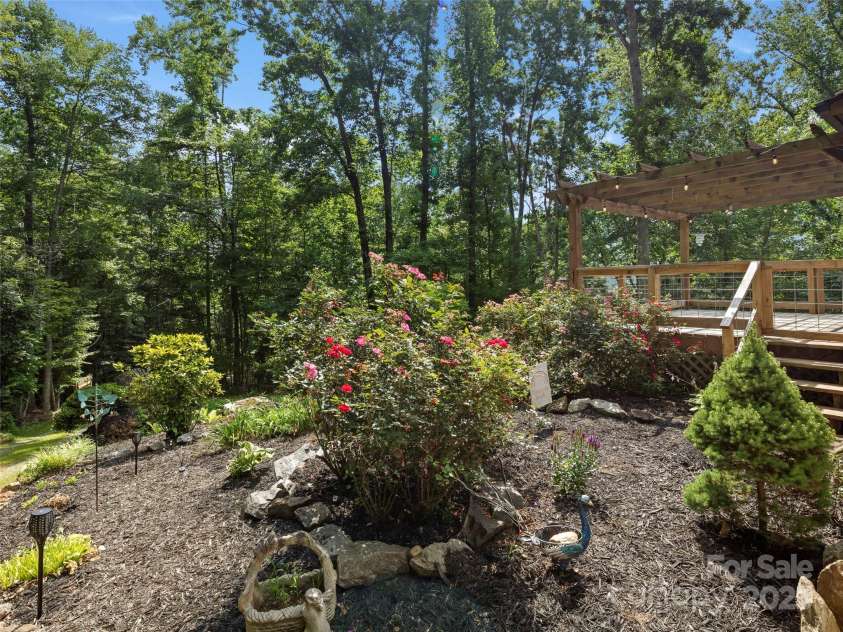 44 Sutton Knob Road, Candler, NC 28715.  MLS# CAR4252708, YatesRealty ID 26806. Beautiful landscaping