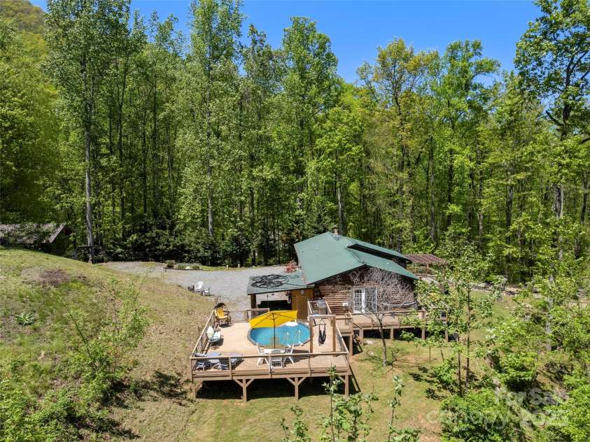 44 Sutton Knob Road, Candler, NC 28715.  MLS# CAR4252708, YatesRealty ID 26806. Drone shot structures