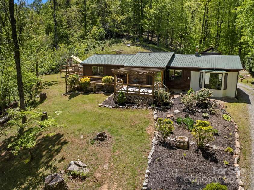 44 Sutton Knob Road, Candler, NC 28715.  MLS# CAR4252708, YatesRealty ID 26806. Front of home landscaping