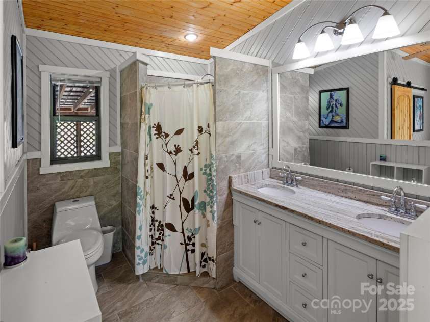 44 Sutton Knob Road, Candler, NC 28715.  MLS# CAR4252708, YatesRealty ID 26806. Primary Bathroom