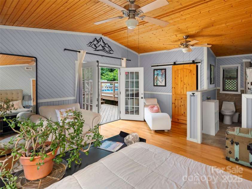 44 Sutton Knob Road, Candler, NC 28715.  MLS# CAR4252708, YatesRealty ID 26806. Primary Bedroom w/ French Doors