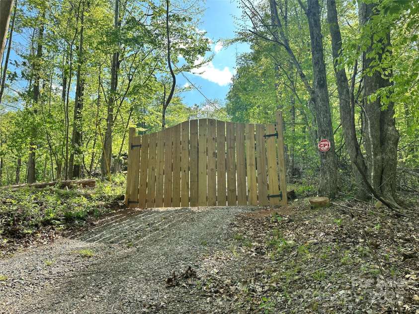 44 Sutton Knob Road, Candler, NC 28715.  MLS# CAR4252708, YatesRealty ID 26806. Privacy gate