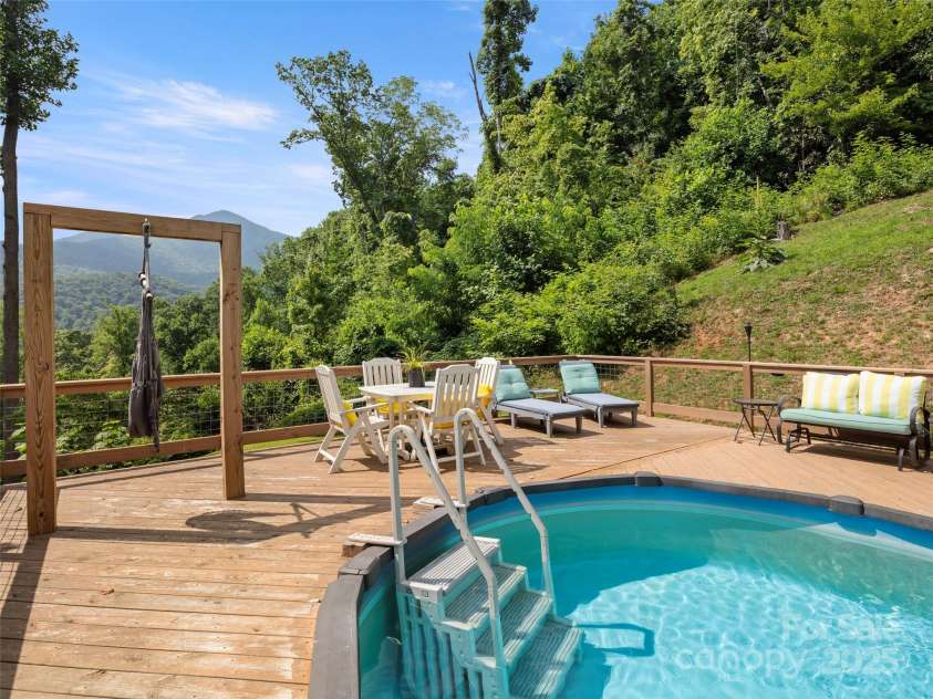 44 Sutton Knob Road, Candler, NC 28715.  MLS# CAR4252708, YatesRealty ID 26806. Salt water pool