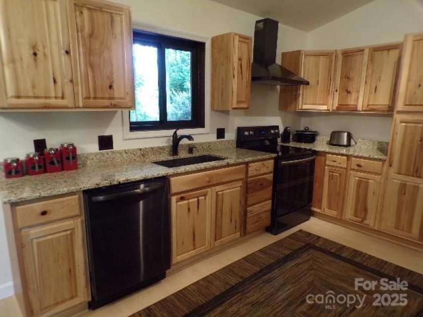 140 Beechwood Circle, Laurel Park, NC 28739.  MLS# CAR4281220, YatesRealty ID 26809. Kitchen