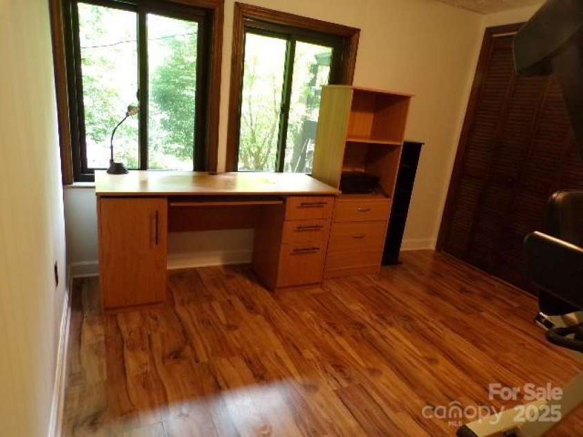 140 Beechwood Circle, Laurel Park, NC 28739.  MLS# CAR4281220, YatesRealty ID 26809. Lower level bedroom