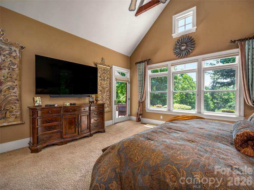 161 Chattooga Run, Hendersonville, NC 28739.  MLS# CAR4385295, YatesRealty ID 26812. Oversized primary bedroom with vaulted ceilings allow for ample natural light