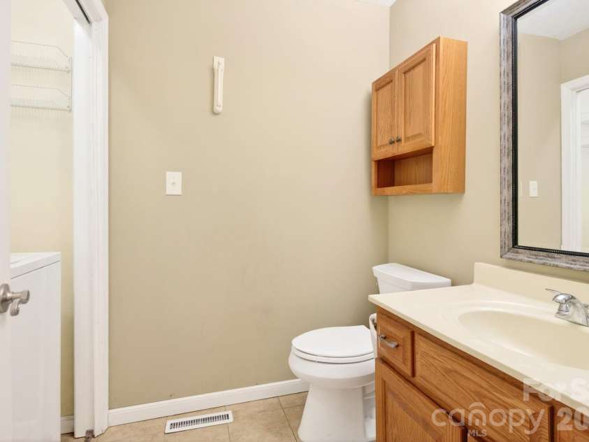 109 Lovers Loop Road, Asheville, NC 28803.  MLS# CAR4380982, YatesRealty ID 26814. Main level half bathroom with laundry