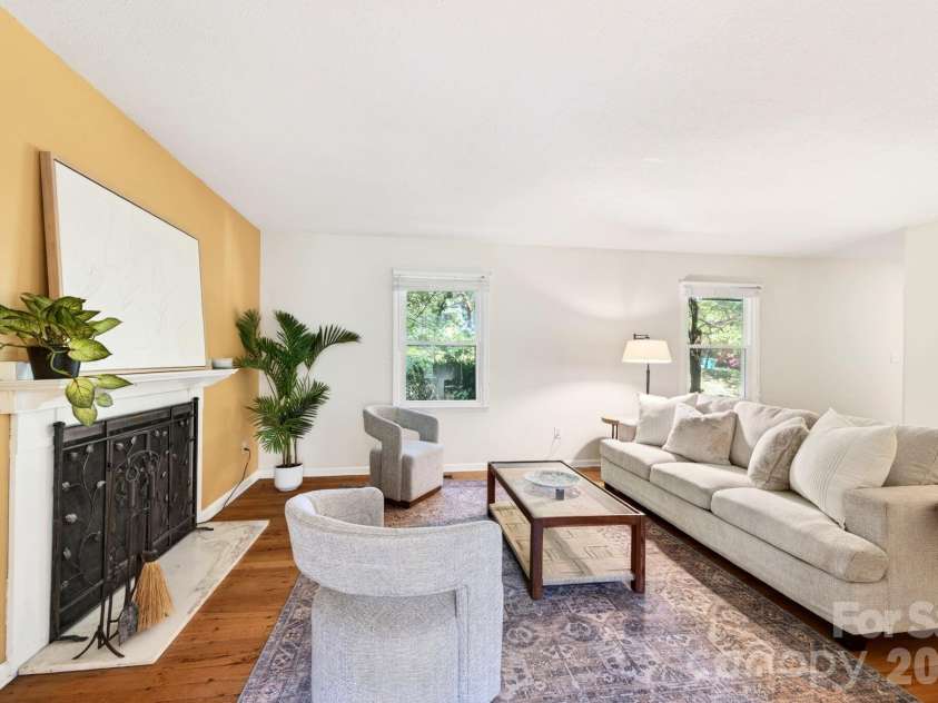 109 Lovers Loop Road, Asheville, NC 28803.  MLS# CAR4380982, YatesRealty ID 26814. The spacious living room has a fireplace