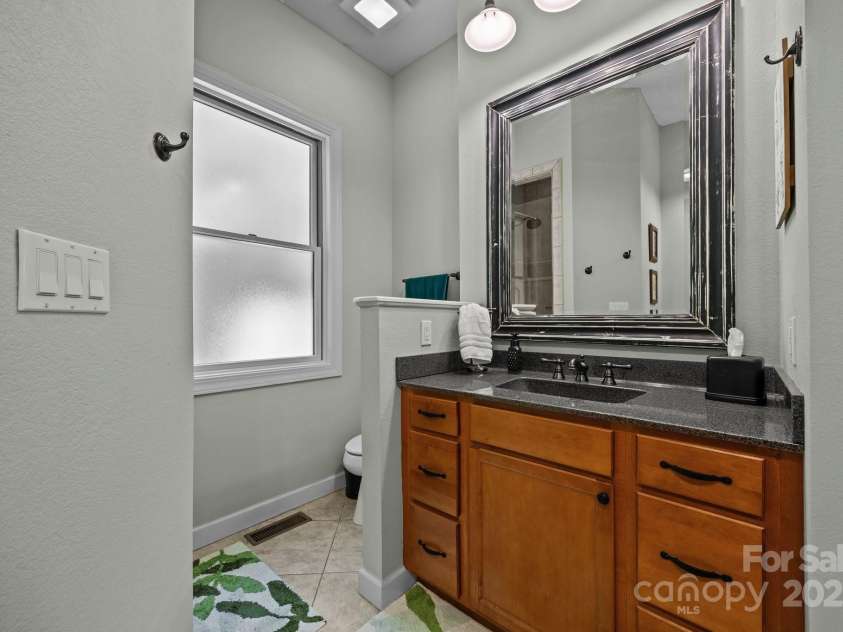 305 Pound Mill Branch Road, Green Mountain, NC 28740.  MLS# CAR4268058, YatesRealty ID 26814. Primary Bathroom