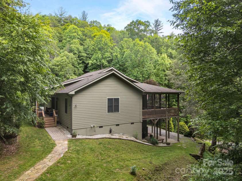 305 Pound Mill Branch Road, Green Mountain, NC 28740.  MLS# CAR4268058, YatesRealty ID 26814. View of home from the gazebo & firepit area.
