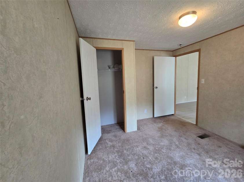 2094 Wilson Road, Asheville, NC 28806.  MLS# CAR4385974, YatesRealty ID 26822. Bedroom three from inside to closet