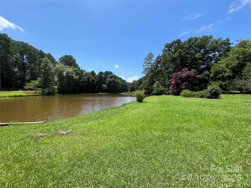207 Leach Street, Biscoe, NC 27209.  MLS# CAR4283219, YatesRealty ID 26826. Pond