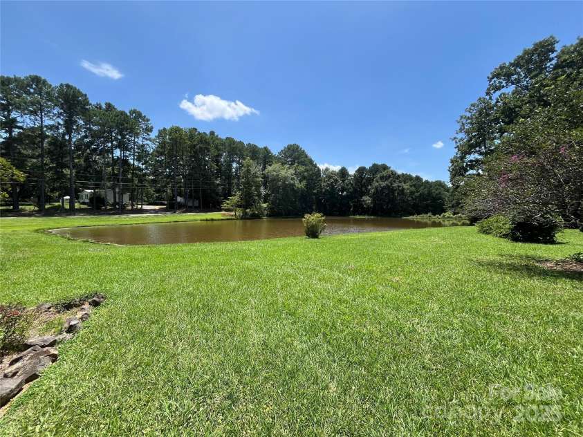 207 Leach Street, Biscoe, NC 27209.  MLS# CAR4283219, YatesRealty ID 26826. Pond