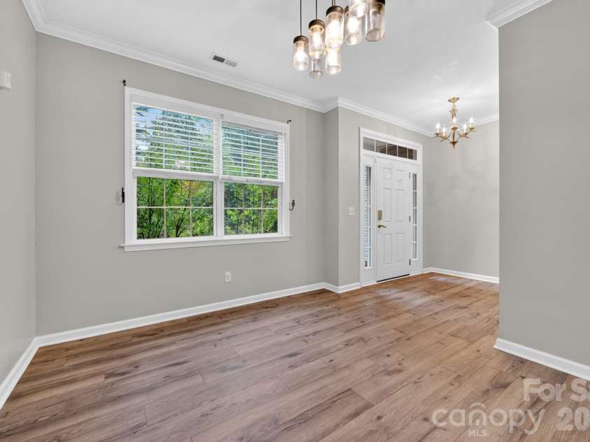 11 Peppermill Drive, Asheville, NC 28804.  MLS# CAR4386908, YatesRealty ID 26829. Front Door into Dining Room
