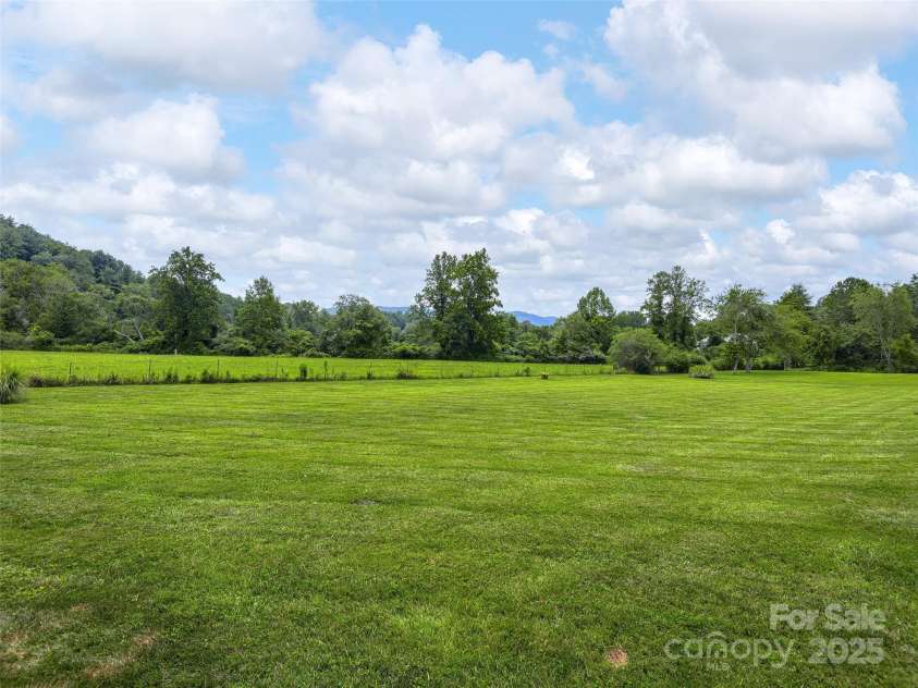 30 Beaumont Drive, Hendersonville, NC 28739.  MLS# CAR4282917, YatesRealty ID 26829. Level Backyard