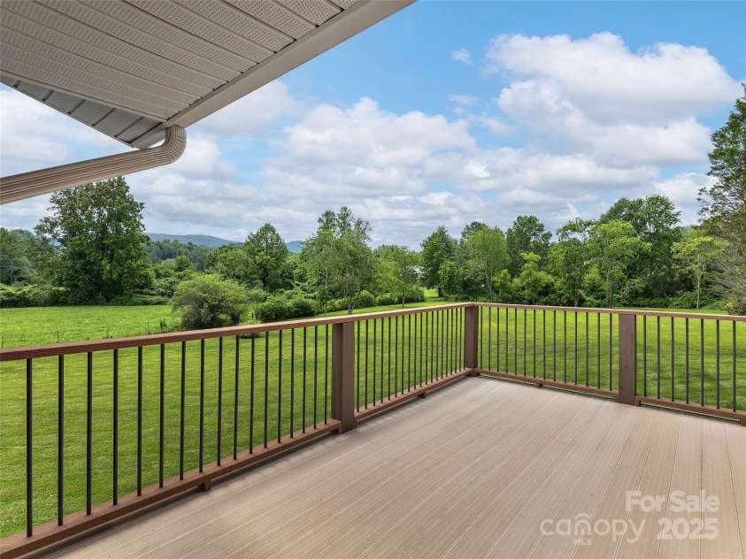 30 Beaumont Drive, Hendersonville, NC 28739.  MLS# CAR4282917, YatesRealty ID 26829. Open deck with mountain and pastoral views