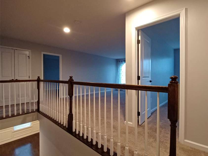 3717 English Garden Drive, Gastonia, NC 28056.  MLS# CAR4272247, YatesRealty ID 26835. Loft at the top of stairway with Oak Railing and white balusters