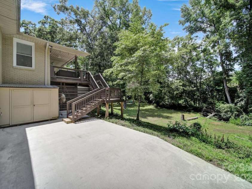 926 Meadow Lakes Road, Rock Hill, SC 29732.  MLS# CAR4269241, YatesRealty ID 26836. Large back patio with storage near stairs and under deck