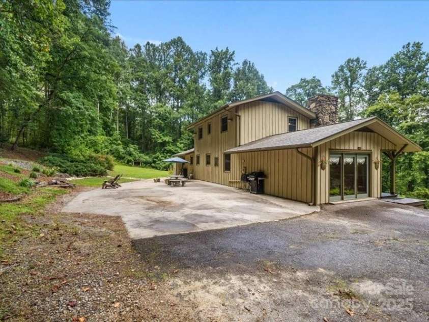 159 Big Poplar Lane, Zirconia, NC 28790.  MLS# CAR4280103, YatesRealty ID 26850. Approx 28 X 68 concrete patio out back.
