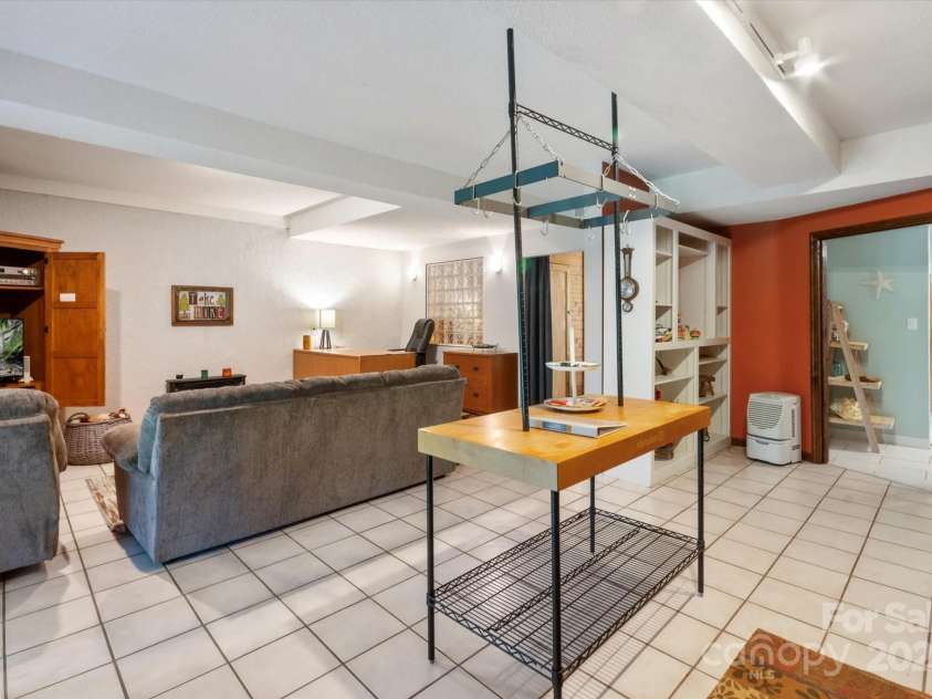 159 Big Poplar Lane, Zirconia, NC 28790.  MLS# CAR4280103, YatesRealty ID 26850. INVESTMENT OPPORTUNITY!! Den w/ office and gas heater