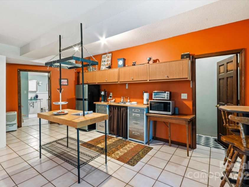 159 Big Poplar Lane, Zirconia, NC 28790.  MLS# CAR4280103, YatesRealty ID 26850. Mini kitchen and work island perfect for AIRBNB