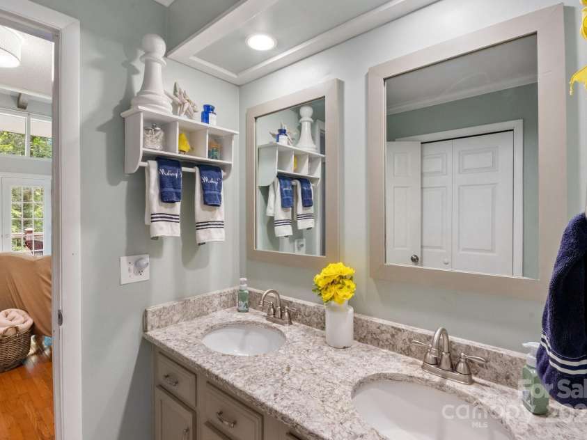 159 Big Poplar Lane, Zirconia, NC 28790.  MLS# CAR4280103, YatesRealty ID 26850. Primary Bathroom on Main level also accessible from Living Room