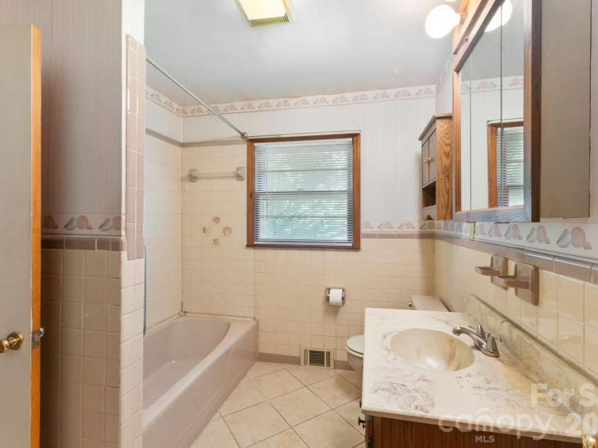 295 Bramlett Drive, Waynesville, NC 28785.  MLS# CAR4381280, YatesRealty ID 26852. Spacious bathroom and even has a window!