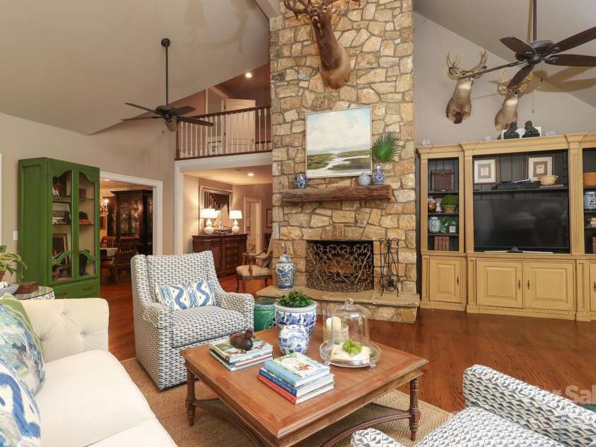 7794 Live Oaks Drive, Denver, NC 28037.  MLS# CAR4234292, YatesRealty ID 26852. Great room with stacked stone fireplace
