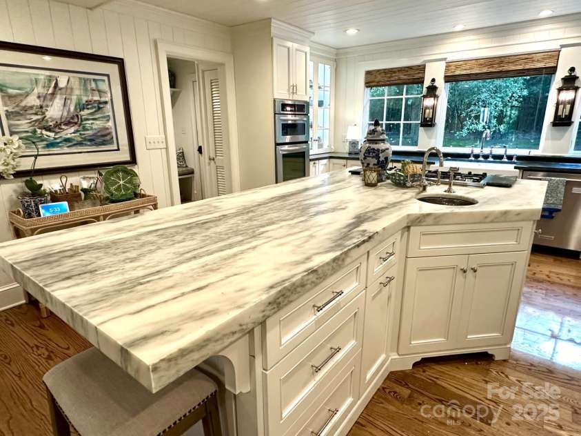 7794 Live Oaks Drive, Denver, NC 28037.  MLS# CAR4234292, YatesRealty ID 26852. Kitchen island with prep sink and second trash roll out
