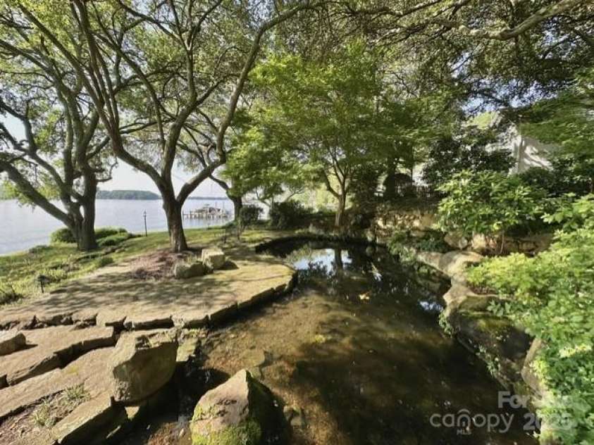 7794 Live Oaks Drive, Denver, NC 28037.  MLS# CAR4234292, YatesRealty ID 26852. Live Oaks Koi pond