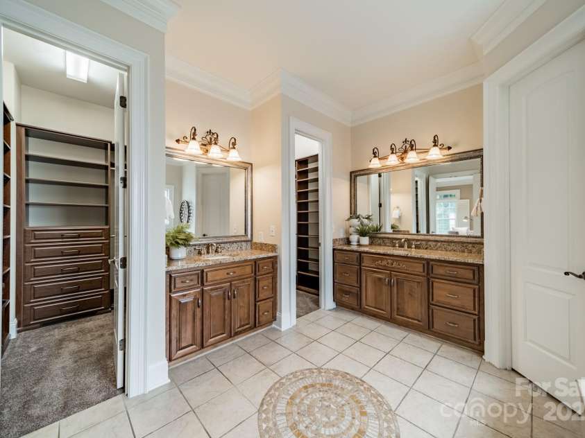 2300 Richardson Drive, Charlotte, NC 28211.  MLS# CAR4266822, YatesRealty ID 26854. Primary bathroom with two closets by Closet By Design