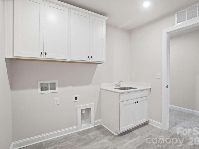 2517 Mabel Lane, Monroe, NC 28110.  MLS# CAR4327123, YatesRealty ID 26861. Digital Image Similar--Upper Level Laundry