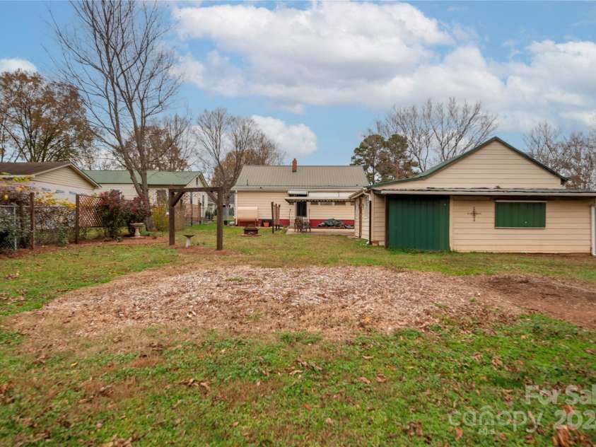 301 Gold Hill Drive, Salisbury, NC 28146.  MLS# CAR4202938, YatesRealty ID 2687. Back yard/garage