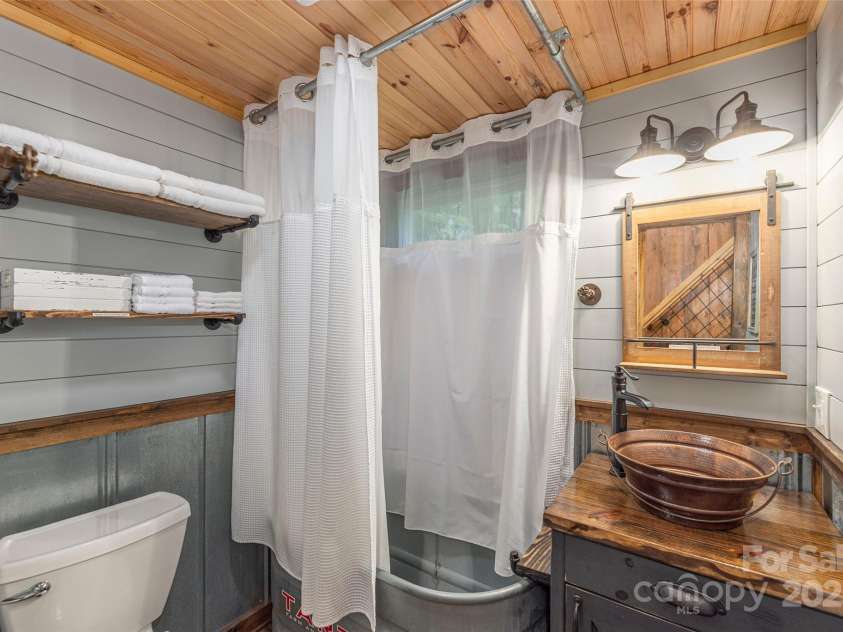 477 Locust Drive, Maggie Valley, NC 28751.  MLS# CAR4276263, YatesRealty ID 26875. Guest Cabin Bathroom