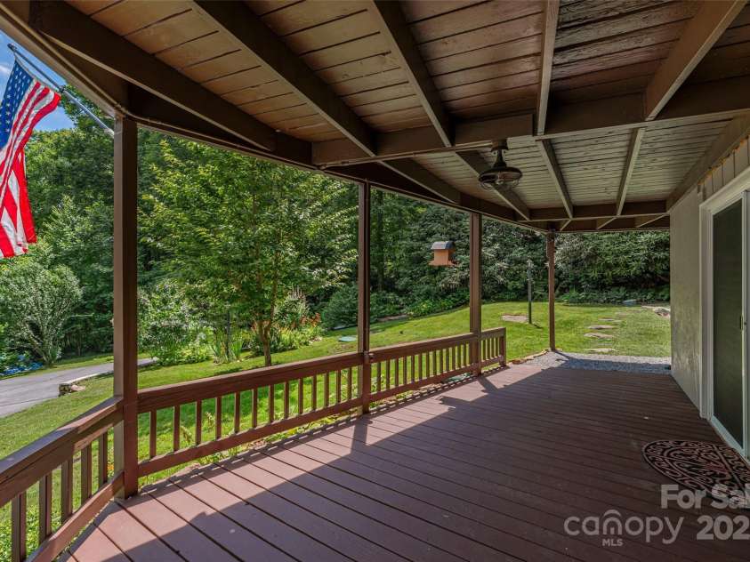 477 Locust Drive, Maggie Valley, NC 28751.  MLS# CAR4276263, YatesRealty ID 26875. Lower Covered Deck