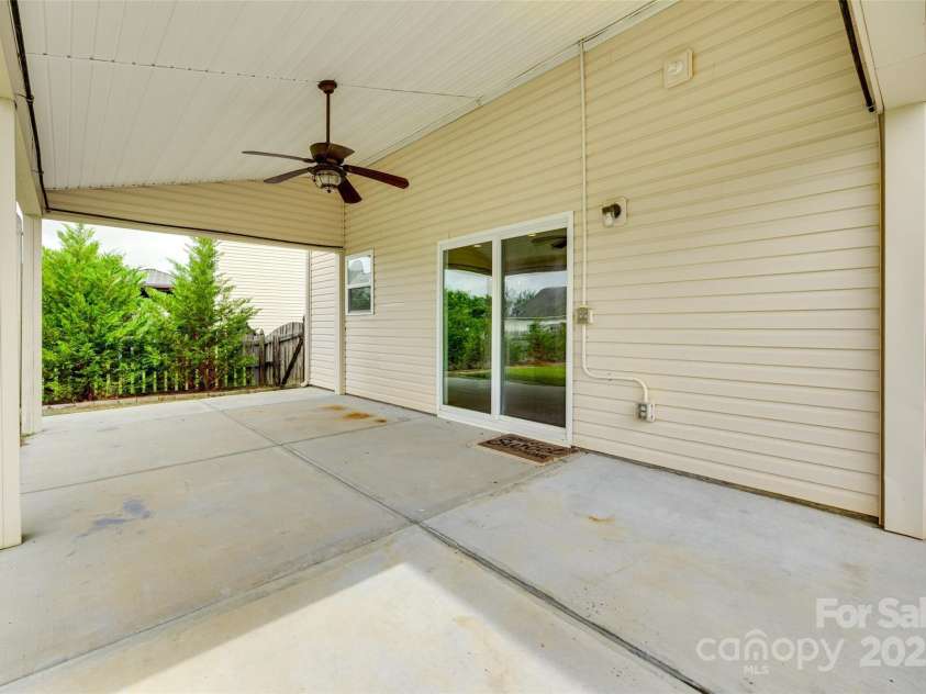 1412 Afternoon Sun Road, Matthews, NC 28104.  MLS# CAR4259106, YatesRealty ID 26877. Covered Back patio