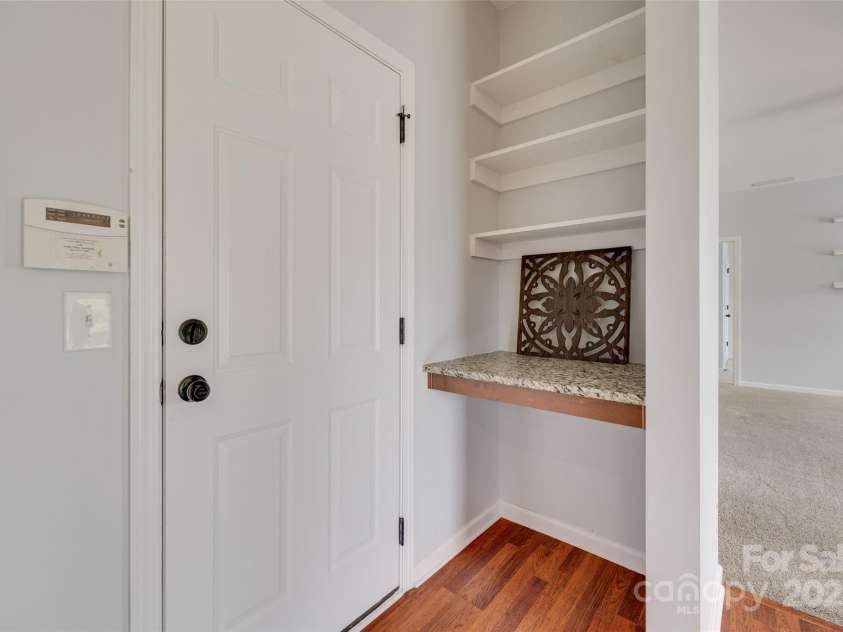 1412 Afternoon Sun Road, Matthews, NC 28104.  MLS# CAR4259106, YatesRealty ID 26877. Desk space in kitchen behind door to garage