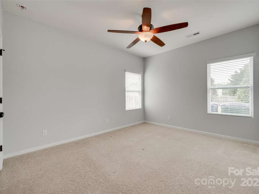 1412 Afternoon Sun Road, Matthews, NC 28104.  MLS# CAR4259106, YatesRealty ID 26877. Down stairs BEDROOM with full bath outside