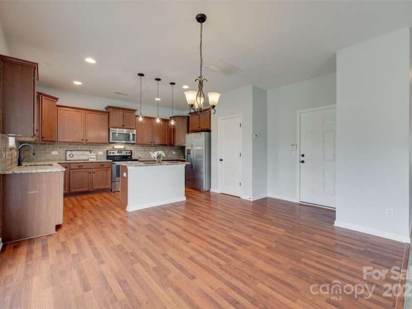 1412 Afternoon Sun Road, Matthews, NC 28104.  MLS# CAR4259106, YatesRealty ID 26877. Ktichen-stainless and travetine back splash